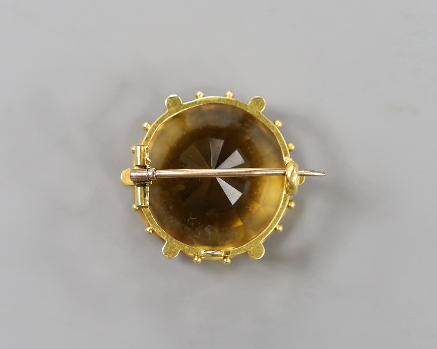 A yellow metal mounted round cut citrine set brooch, 24mm, gross weight 15.4 grams.